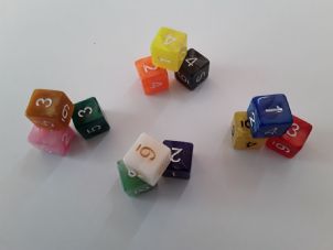 Orange marble with white numbers six sided dice
