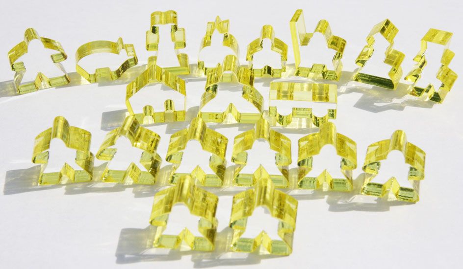 Complete 19 piece yellow transparent set of Carcassonne meeples